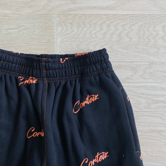 Corteiz All Over Print Joggers Black Orange